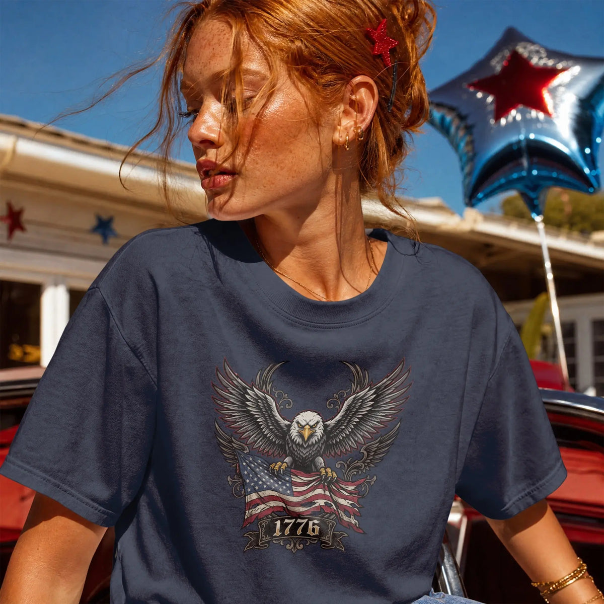 Navy t-shirt with eagle, American flag, and "1776" graphic.