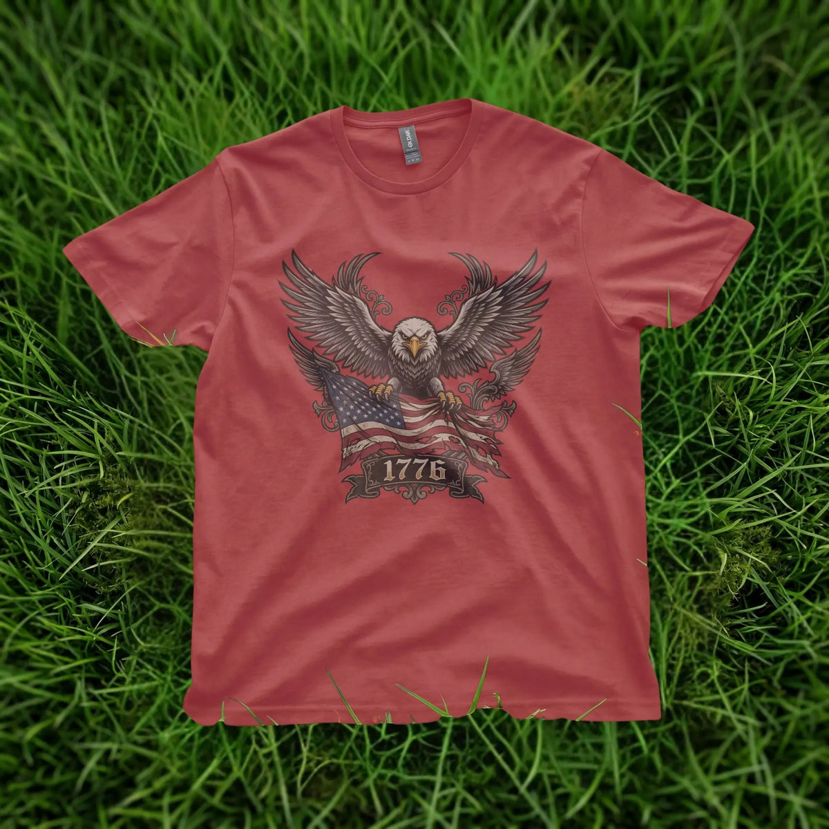 Red t-shirt with eagle, American flag, and "1776" graphic print.