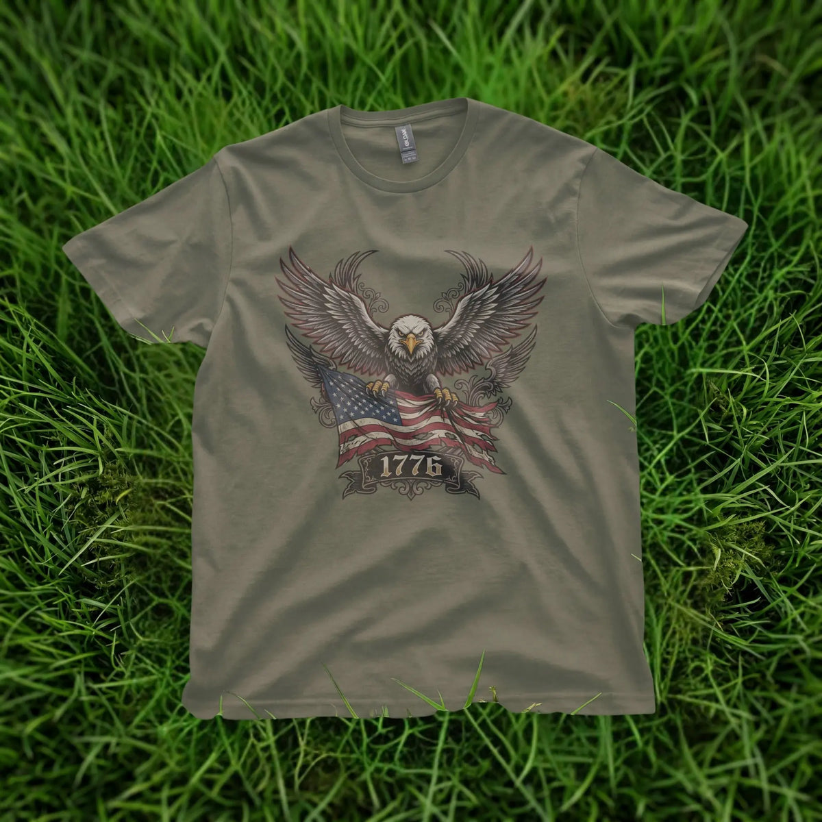Olive t-shirt with an eagle holding the American flag and the year 1776.