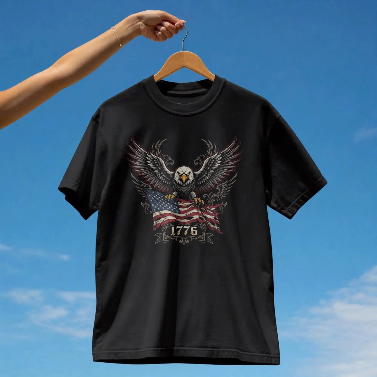 Black t-shirt featuring an eagle holding an American flag with "1776" text.