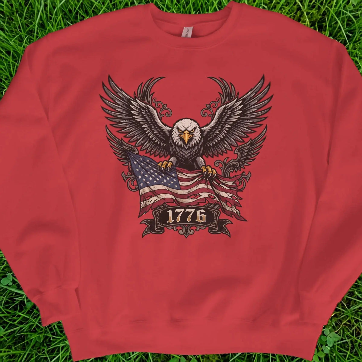 Red crewneck sweatshirt with eagle, American flag, and "1776" text graphic.