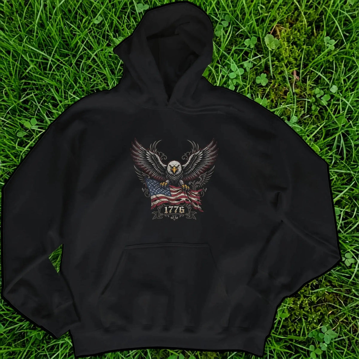 Black hoodie with an eagle holding an American flag and the year 1776.